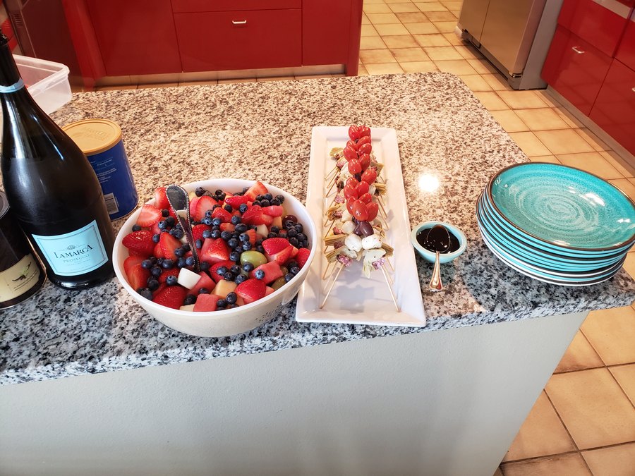 Fresh berry and dessert display on the counter