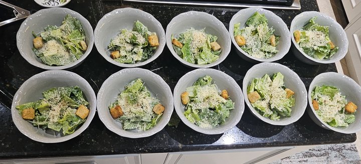 Caesar salad bowls in a row