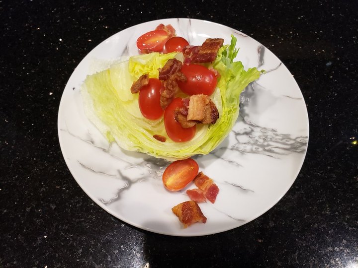 Tomato and lettuce salad on marble