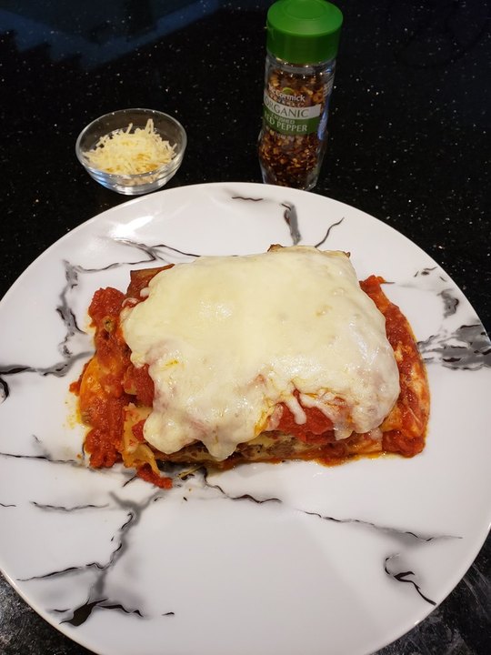 Chicken parmesan on a marble plate