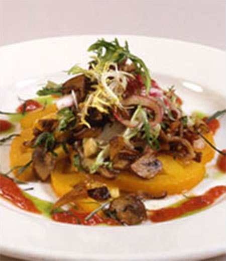 Plated entrée with crispy topping