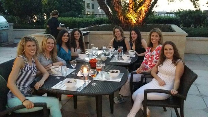 Guests dining on the patio at night