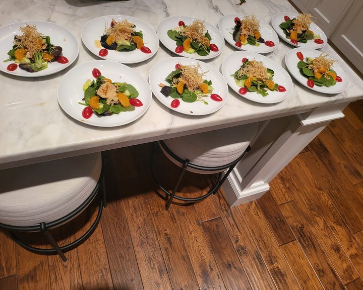 Plated salads on the kitchen island