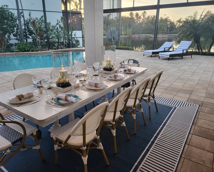 Dining table set beside the pool