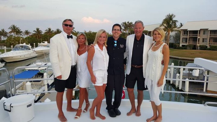 Group on the dock by the boats